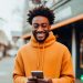 man researching the best money saving apps to download