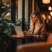 woman at laptop contemplating her spending habits