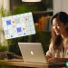 A social media manager reviewing a content schedule on her laptop.