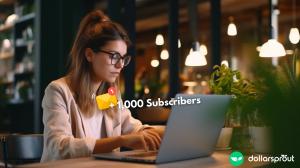 A female blogger typing an email on her laptop to send to her list. There is a small icon signifying +1,000 subsribers.