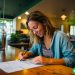 woman filling out a money order