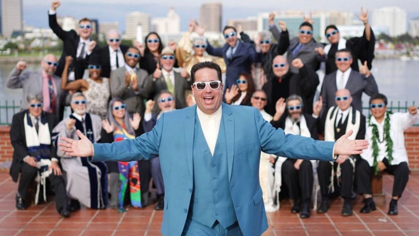 katz in front of a wedding party