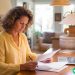 A woman in her forties working from home as a freelance proofreader.