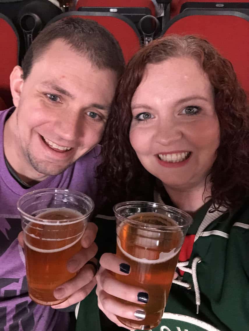 Micah Jankowski and Husband at a hockey game 