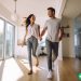 A couple walking through a rental property, hoping to turn it into a source of passive income