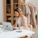 A woman on her laptop using Pinterest to promote her brand.