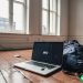 A laptop sitting on a bare wooden living room floor, representing the risk that entrepreneurs take when venturing out on their own.