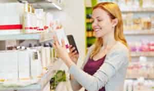 woman using cash back app to save money