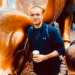 Jeff Proctor from DollarSprout standing next to the bull statue on Wall St.